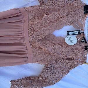 NWT Discounted Shipping . Formal backless skater, lace sleeved dress, size 14.